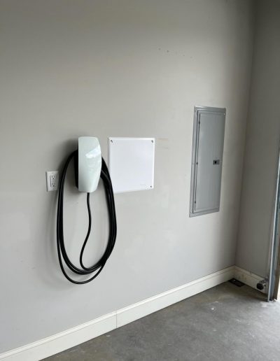 Hard-wired Tesla wall charger installed with 60 amp circuit, no damage to customer's walls!
